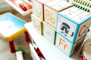 Set of kid toys on a white shelf Set of kid toys on a white shelf